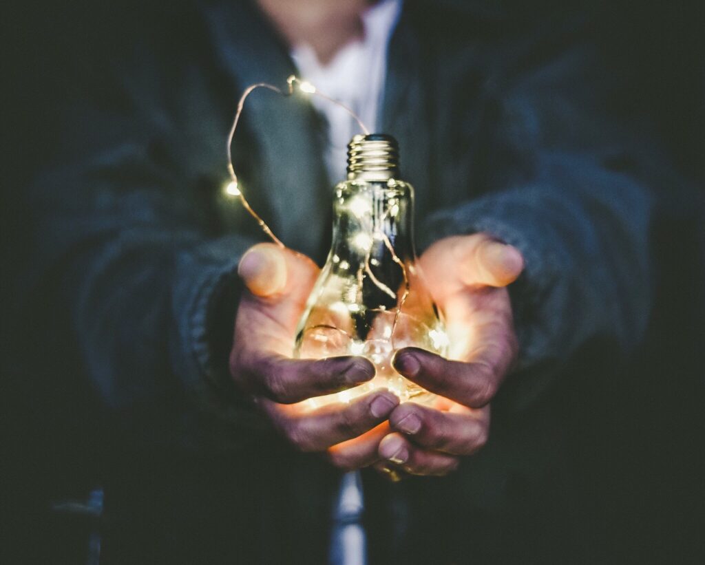 lightbulb in someone's hands