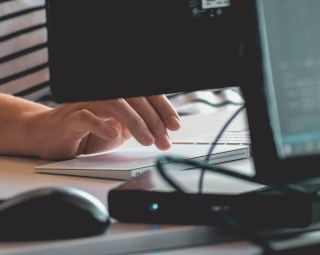 up close of a hand typing on a computer keyboard
