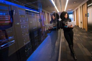 Woman Standing by Web Servers
