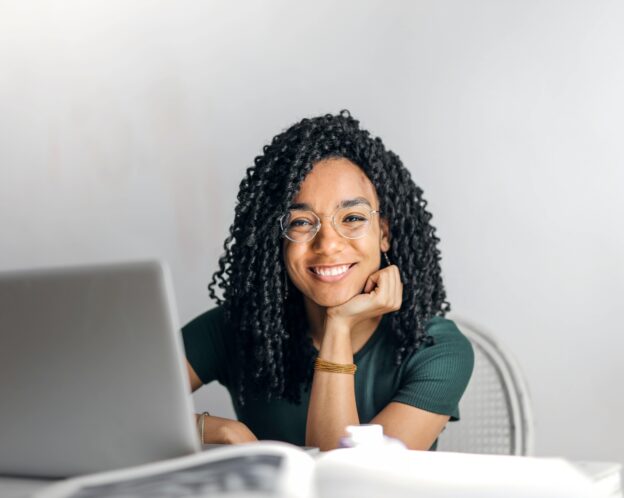 student sitting at her laptop